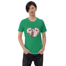 Load image into Gallery viewer, A man wearing the Barn Owl Love Premium Unisex  T-Shirt in kelly green, includes art of two barn owls forming the shape of a heart.
