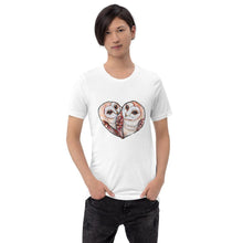 Load image into Gallery viewer, A man wearing the Barn Owl Love Premium Unisex T-Shirt in white colour, includes two barn owls forming the shape of a heart.
