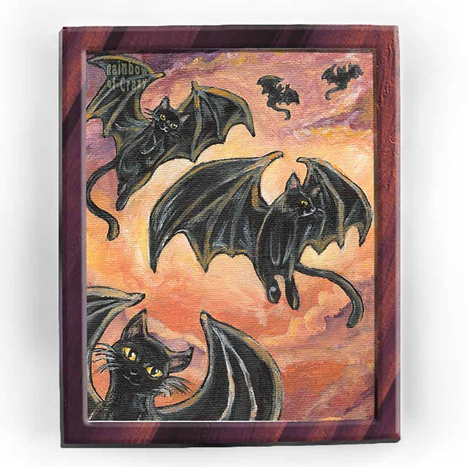 This art print features 5 black cats with giant bat wings, soaring through the cloudy orange sky