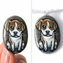 Load image into Gallery viewer, a small beach stone, hand painted with a portrait of a beagle puppy. available as a keepsake rock art or pendant necklace
