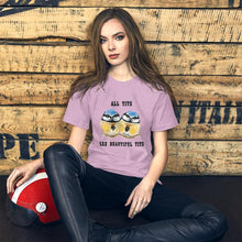 Load image into Gallery viewer, A woman wearing the Beautiful Tits Premium Unisex T-shirt in heather prism lilac, with art of two blue tit birds, and the words, &quot;all tits are beautiful tits&quot;
