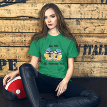 Load image into Gallery viewer, A woman wearing the Beautiful Tits Premium Unisex T-shirt in kelly green, with art of two blue tit birds, and the words, &quot;all tits are beautiful tits&quot;
