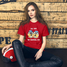 Load image into Gallery viewer, A woman wearing the Beautiful Tits Premium Unisex T-shirt in red, with art of two blue tit birds, and the words, &quot;all tits are beautiful tits&quot;
