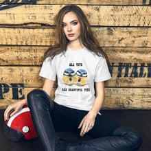 Load image into Gallery viewer, A woman wearing the Beautiful Tits Premium Unisex T-shirt in white with art of two blue tit birds, and the words, &quot;all tits are beautiful tits&quot;
