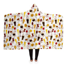 Load image into Gallery viewer, a woman wears the Beer Lovers Hooded Blanket: a white hooded blanket printed with a variety of different beer styles in different glasses
