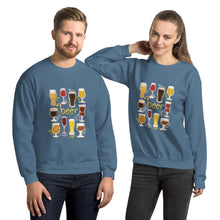 Load image into Gallery viewer, A man and woman wearing the Beer Lovers Unisex Sweatshirt in the colour indigo blue, featuring art of 10 styles of beer in 10 different glasses
