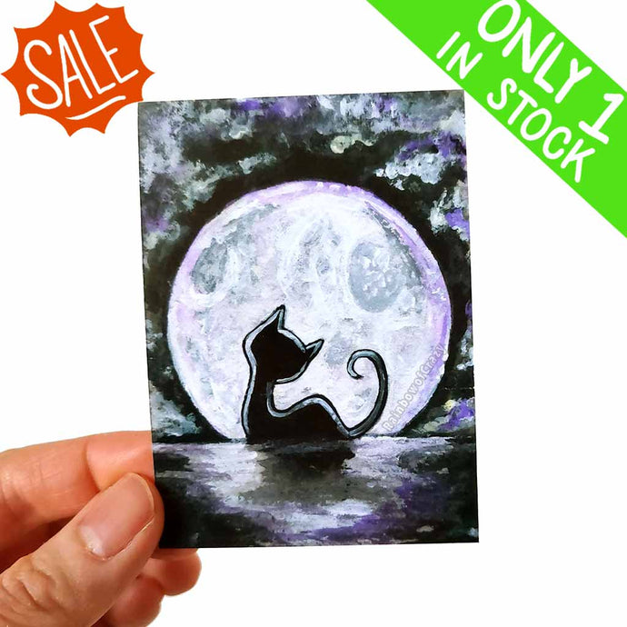 an aceo that features a silhouette of a little black cat in front of a glowing full moon
