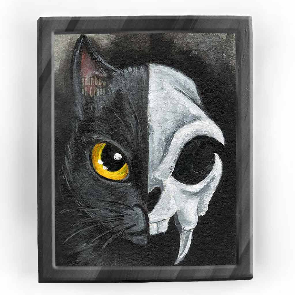 An art print split in half: the left side shows one side of a black cat's face, with a yellow eye, and the right side shows a stylized cat skull
