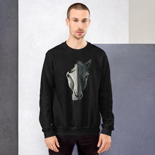 Load image into Gallery viewer, A man is wearing a unisex sweatshirt in the colour black, which is printed with a split graphic: the right side features the face of a black horse, and the left side features an evil looking horse skull
