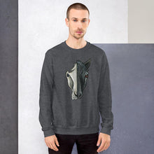 Load image into Gallery viewer, A man is wearing a unisex sweatshirt in the colour dark heather grey, which is printed with a split illustration: the right side features the face of a black horse, and the left side features an evil looking horse skull

