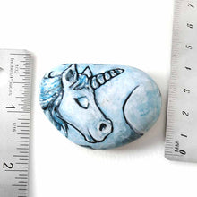 Load image into Gallery viewer, small rock art hand painted with the portrait of a light blue unicorn with its eyes closed
