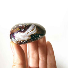 Load image into Gallery viewer, a small beach stone hand painted with a boxer dog
