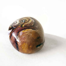 Load image into Gallery viewer, a small beach stone hand painted with a boxer dog
