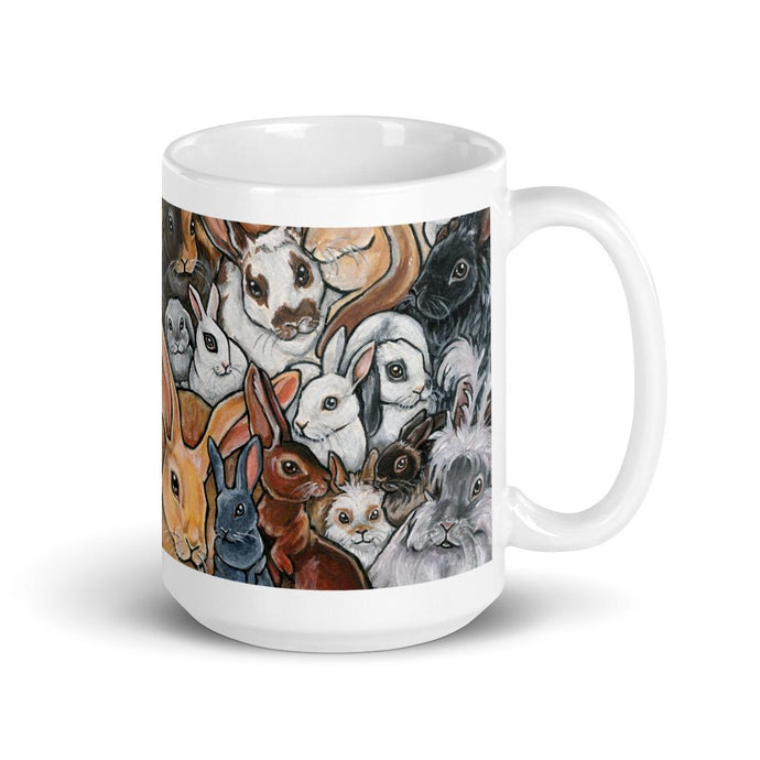 A 15 oz white ceramic mug, printed with art of many different breeds of bunny rabbits