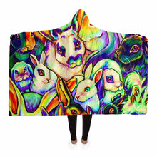 Load image into Gallery viewer, a woman wears the Bunny Lovers Rainbow Hooded Blanket
