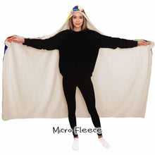 Load image into Gallery viewer, a woman wears the Bunny Lovers Rainbow Hooded Blanket, linked with micro fleece
