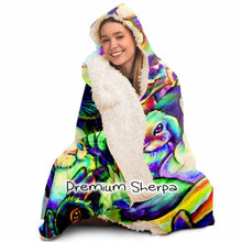 Load image into Gallery viewer, a woman wears the Bunny Lovers Rainbow Hooded Blanket, linked with sherpa
