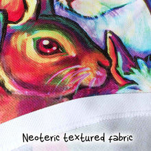 Load image into Gallery viewer, close-up, showing the texture of the women&#39;s performance racerback tank top, with an all-over-print of different rabbit breeds, in rainbow colours
