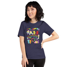 Load image into Gallery viewer, A woman wearing the Candy Lovers Premium Unisex T-shirt in heather midnight navy, which includes art of 10 types of rainbow candy
