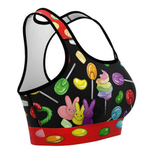 Load image into Gallery viewer, The Candy Lovers Sports Bra, featuring art of different rainbow candy.
