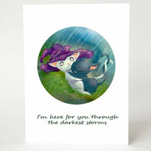 Load image into Gallery viewer, A sympathy card featuring an illustration of a white cat with a purple witch hat, holding tightly onto a scared black cat, as the hat protects them both from the pouring rain.
