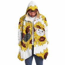 Load image into Gallery viewer, a man wears a white microfiber fleece cloak, printed with sunflower art, with a black cat and white cat peeking out from the flowers
