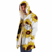 Load image into Gallery viewer, a man wears a white microfiber fleece cloak, printed with sunflower art, with a black cat and white cat peeking out from the flowers
