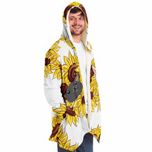 Load image into Gallery viewer, a man wears a white microfiber fleece cloak, printed with sunflower art, with a black cat and white cat peeking out from the flowers
