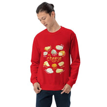 Load image into Gallery viewer, A man is wearing the Cheese Lovers Unisex Sweatshirt in the colour red, which is printed with a graphic of ten different types of cheeses
