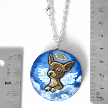 Load image into Gallery viewer, a small lightweight wood circle, hand painted with the portrait of a chihuahua as an angel in the clouds. available as a keepsake or pendant necklace
