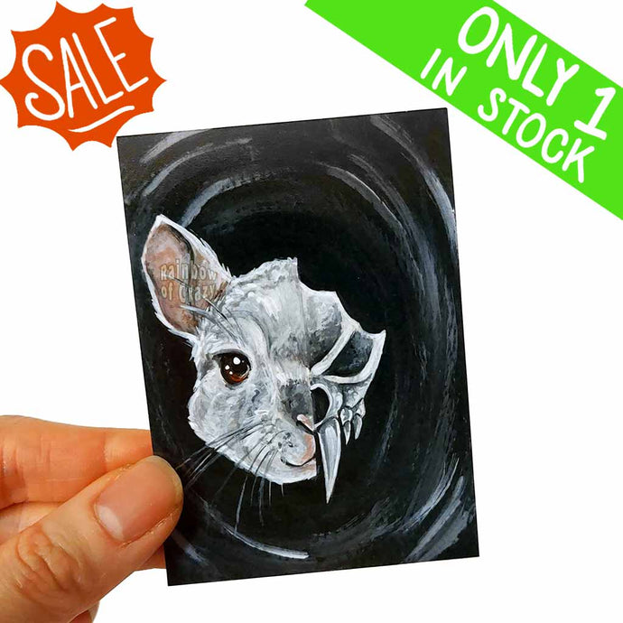 an aceo, featuring a split portrait, with a chinchilla's face on the left side, and a stylized, creepy chinchilla skull on the right side