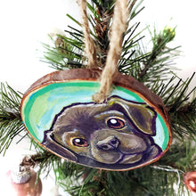 Load image into Gallery viewer, A wood Christmas ornament, hand painted with art of a brown labrador dog with reddish brown eyes
