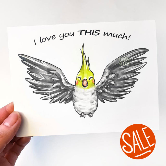 A greeting card with art of a cockatiel with wings spread out. The card reads, 