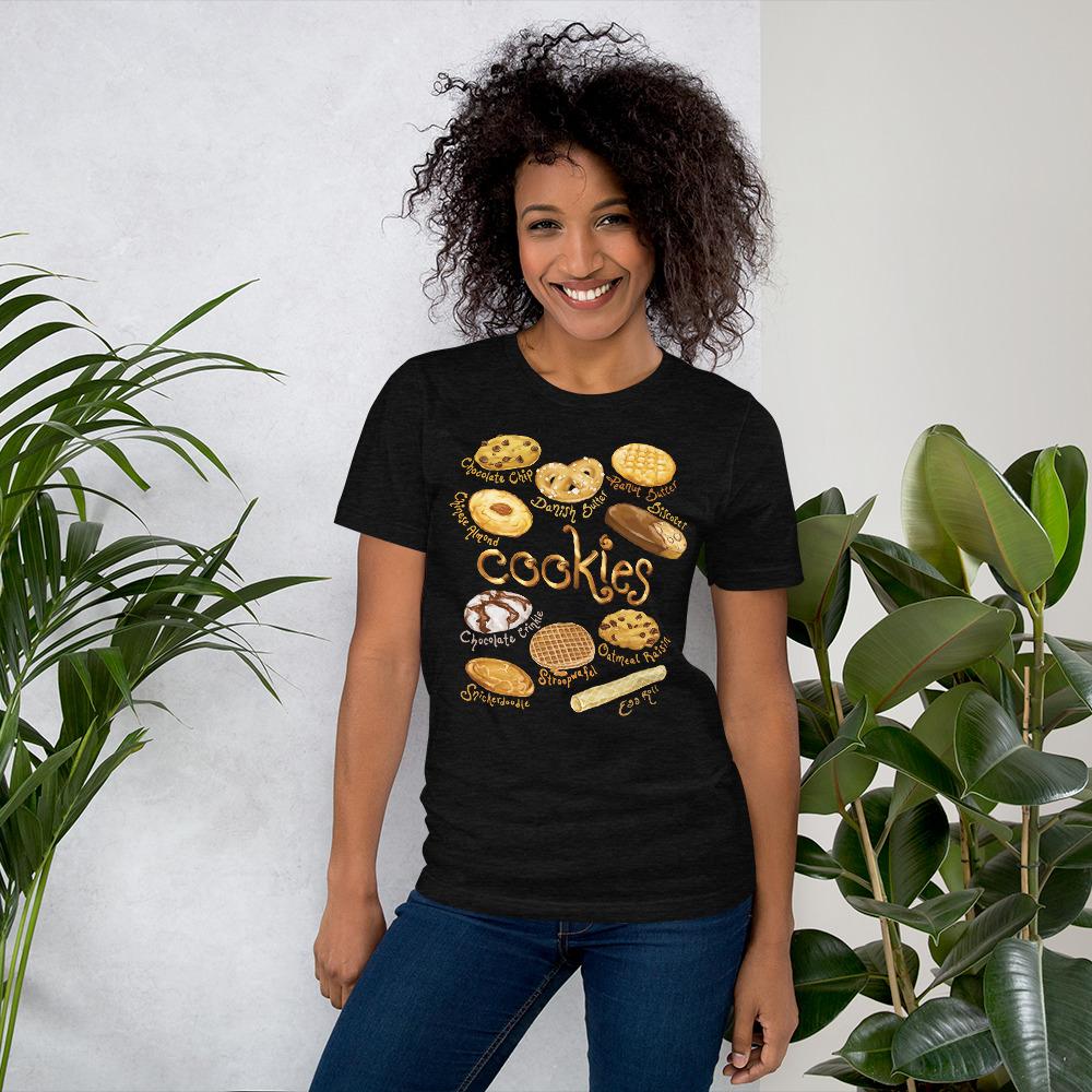A woman is wearing the Cookie Lovers Unisex Premium T-shirt in the colour black heather, features art of 10 different types of cookies.