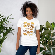 Load image into Gallery viewer, A woman is wearing the Cookie Lovers Unisex Premium T-shirt in the colour white, with a graphic of 10 different types of cookies
