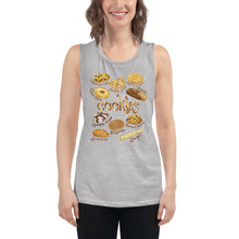 Load image into Gallery viewer, A woman is wearing the Cookie Lovers Women&#39;s Muscle Tank Top in the colour athletic heather grey, which is printed with artwork of 10 different types of cookies
