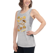 Load image into Gallery viewer, A woman is wearing the Cookie Lovers Women&#39;s Muscle Tank Top in the colour athletic heather grey, which is printed with art of 10 different types of cookies
