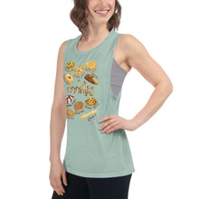 Load image into Gallery viewer, A woman is wearing the Cookie Lovers Women&#39;s Muscle Tank Top in the colour dusty blue, which is printed with a graphic of 10 different types of cookies
