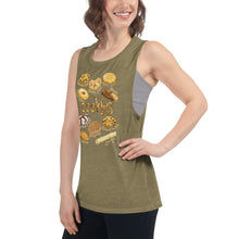 Load image into Gallery viewer, A woman is wearing the Cookie Lovers Women&#39;s Muscle Tank Top in the colour olive green, which is printed with art of 10 different types of cookies
