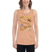 Load image into Gallery viewer, A woman is wearing the Cookie Lovers Women&#39;s Muscle Tank Top in the colour peach, which is printed with artwork of 10 different types of cookies

