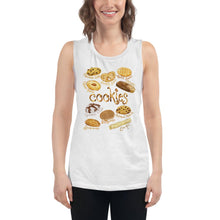 Load image into Gallery viewer, A woman is wearing the Cookie Lovers Women&#39;s Muscle Tank Top in the colour white, which is printed with art of 10 different types of cookies
