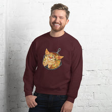 Load image into Gallery viewer, A man is wearing a unisex sweatshirt in the colour maroon, featuring an illustration of a cornbread cat with jalapenos, sitting in a cast iron pan.
