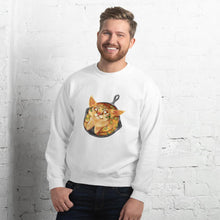 Load image into Gallery viewer, A man is wearing a unisex sweatshirt in the colour white, featuring an illustration of a cornbread cat with jalapenos, sitting in a cast iron pan.
