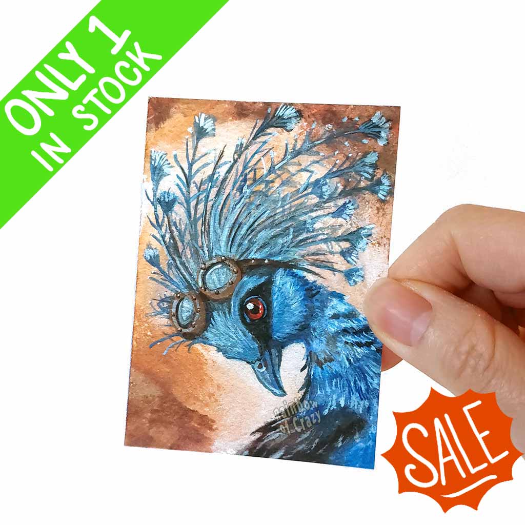 an aceo art print of a crowned pigeon wearing steampunk style goggles on its head 