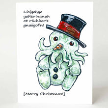 Load image into Gallery viewer, A Christmas card with art of Cthulhu as a snowman. It reads, &quot;Lloigehye yah&#39;or&#39;nanah ot r&#39;luhhor&#39;s gnaiigof&#39;n!&quot; above and &quot;[Merry Christmas!]&quot; below
