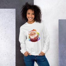 Load image into Gallery viewer, A woman wears a unisex sweatshirt in the colour white, featuring art of a cat painted as a red velvet cupcake with rainbow sprinkles.
