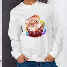 Load image into Gallery viewer, A woman wears a unisex sweatshirt in the colour white, featuring art of a cat painted as a red velvet cupcake with rainbow sprinkles.
