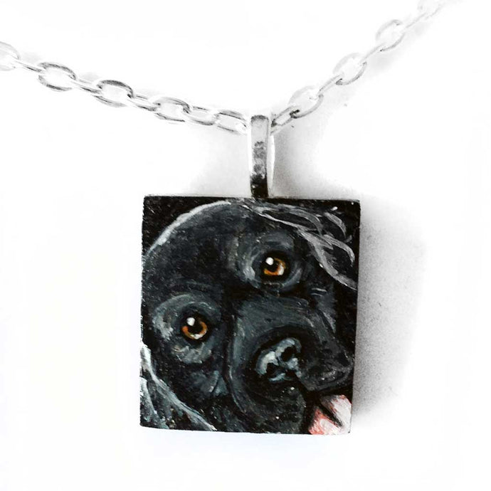 a scrabble tile pendant necklace, hand painted with a portrait of a black labrador retriever dog