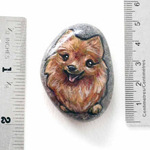 Load image into Gallery viewer, a small rock art featuring a smiling pomeranian dog
