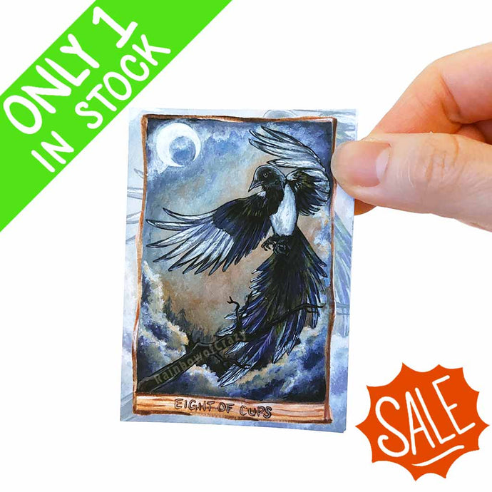 an aceo art print of the eight of cups tarot card from the Animism Tarot:  a beautiful magpie with wings spread wide. Ready to take flight, the black bird rises from a tree. 